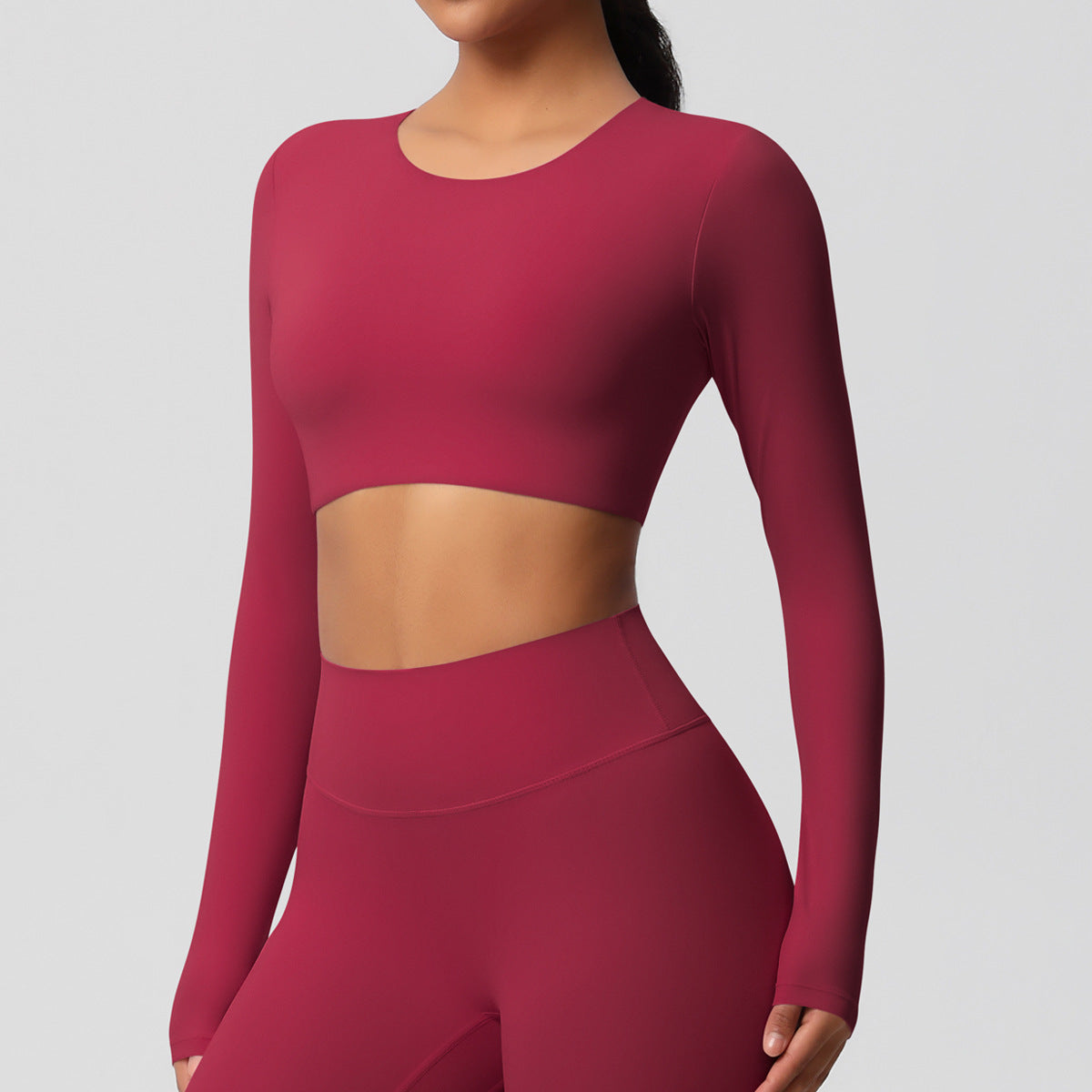 Brushed long-sleeved yoga top with padded bra and tight fit.