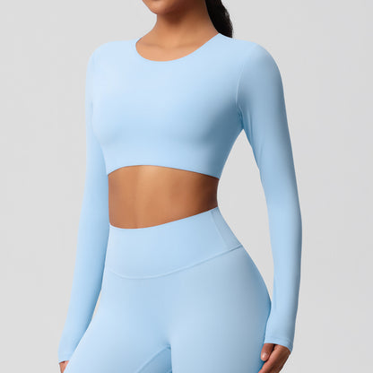 Brushed long-sleeved yoga top with padded bra and tight fit.