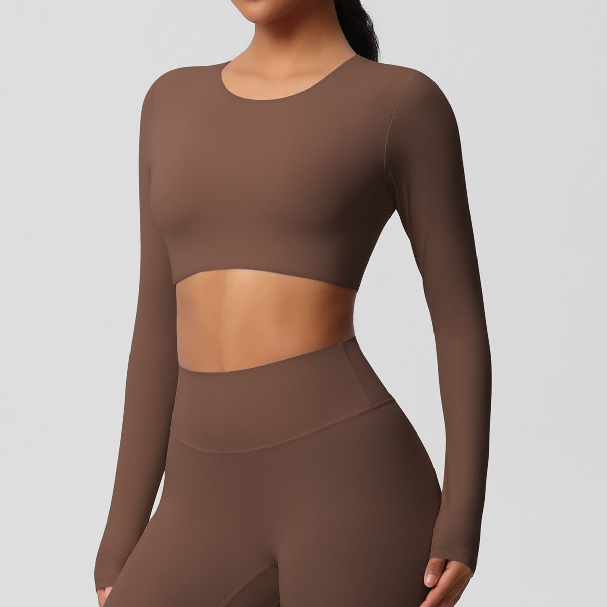 Brushed long-sleeved yoga top with padded bra and tight fit.