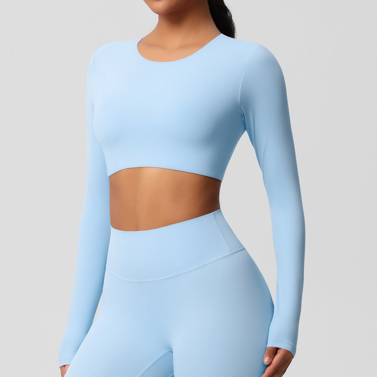 Brushed long-sleeved yoga top with padded bra and tight fit.