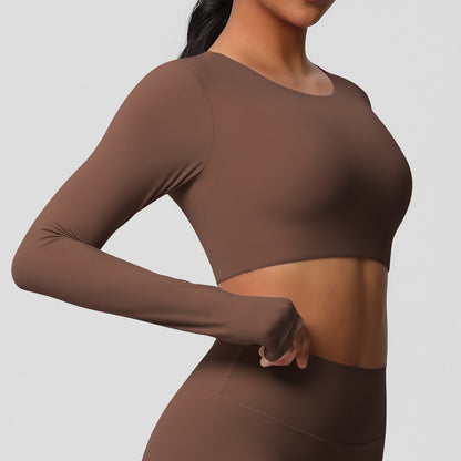 Brushed long-sleeved yoga top with padded bra and tight fit.