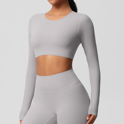 Brushed long-sleeved yoga top with padded bra and tight fit.