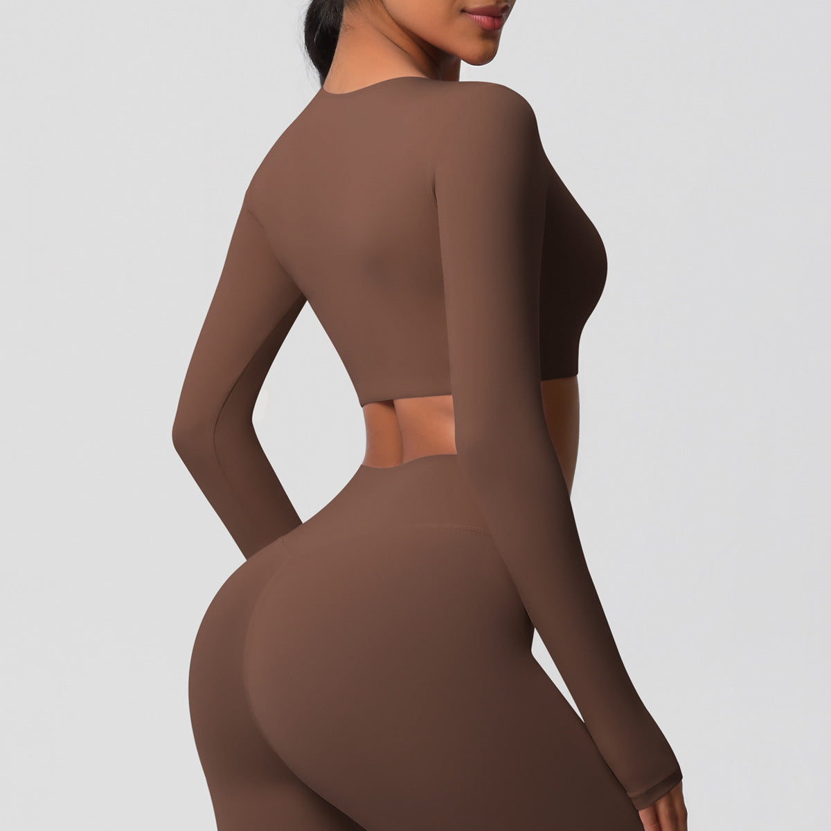 Brushed long-sleeved yoga top with padded bra and tight fit.