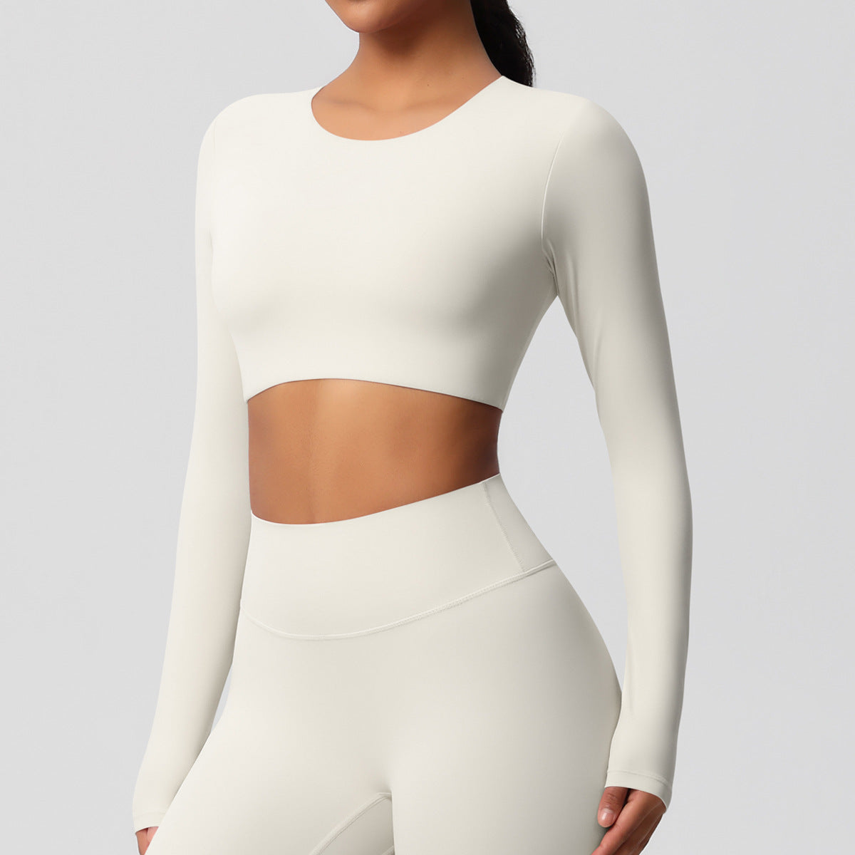 Brushed long-sleeved yoga top with padded bra and tight fit.