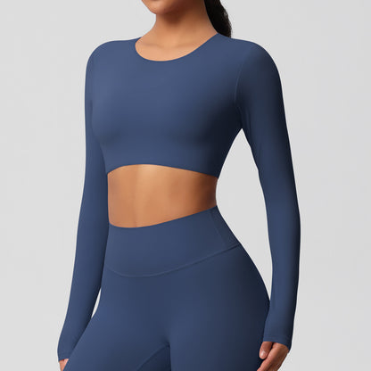 Brushed long-sleeved yoga top with padded bra and tight fit.